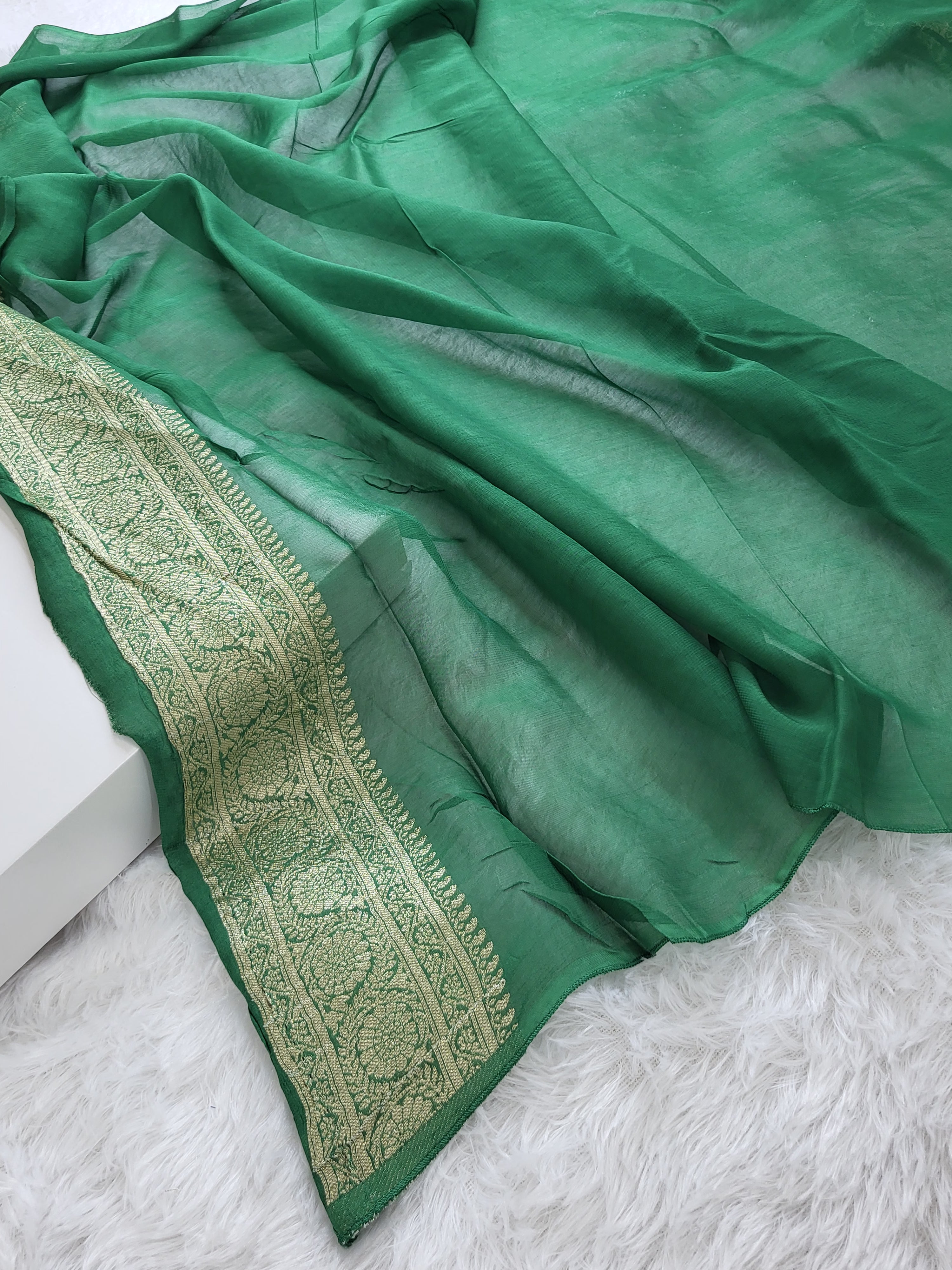 Georgette saree in floral jaal design in Bottle Green color