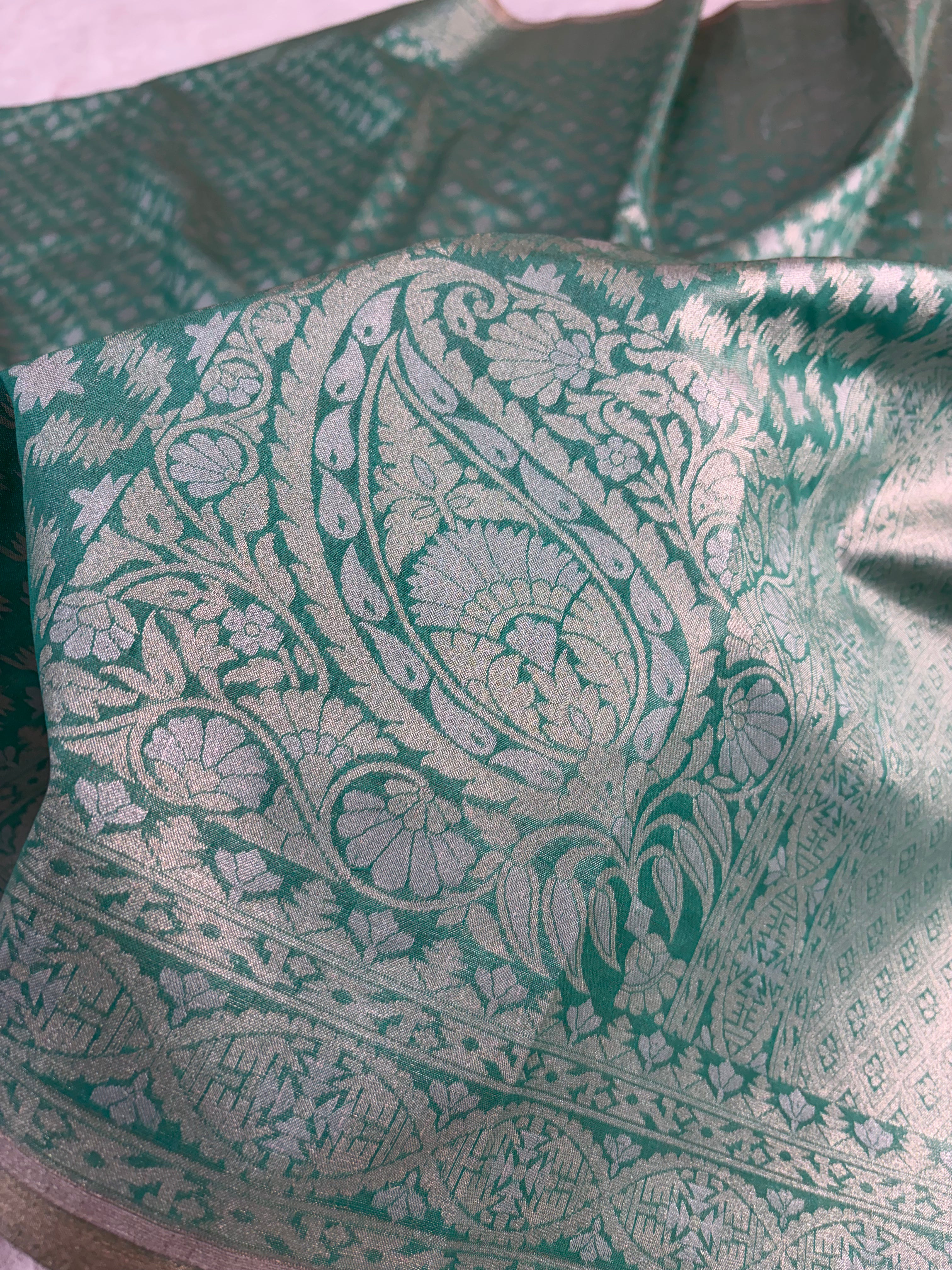 Banarasi tissue silk saree in bottle green color