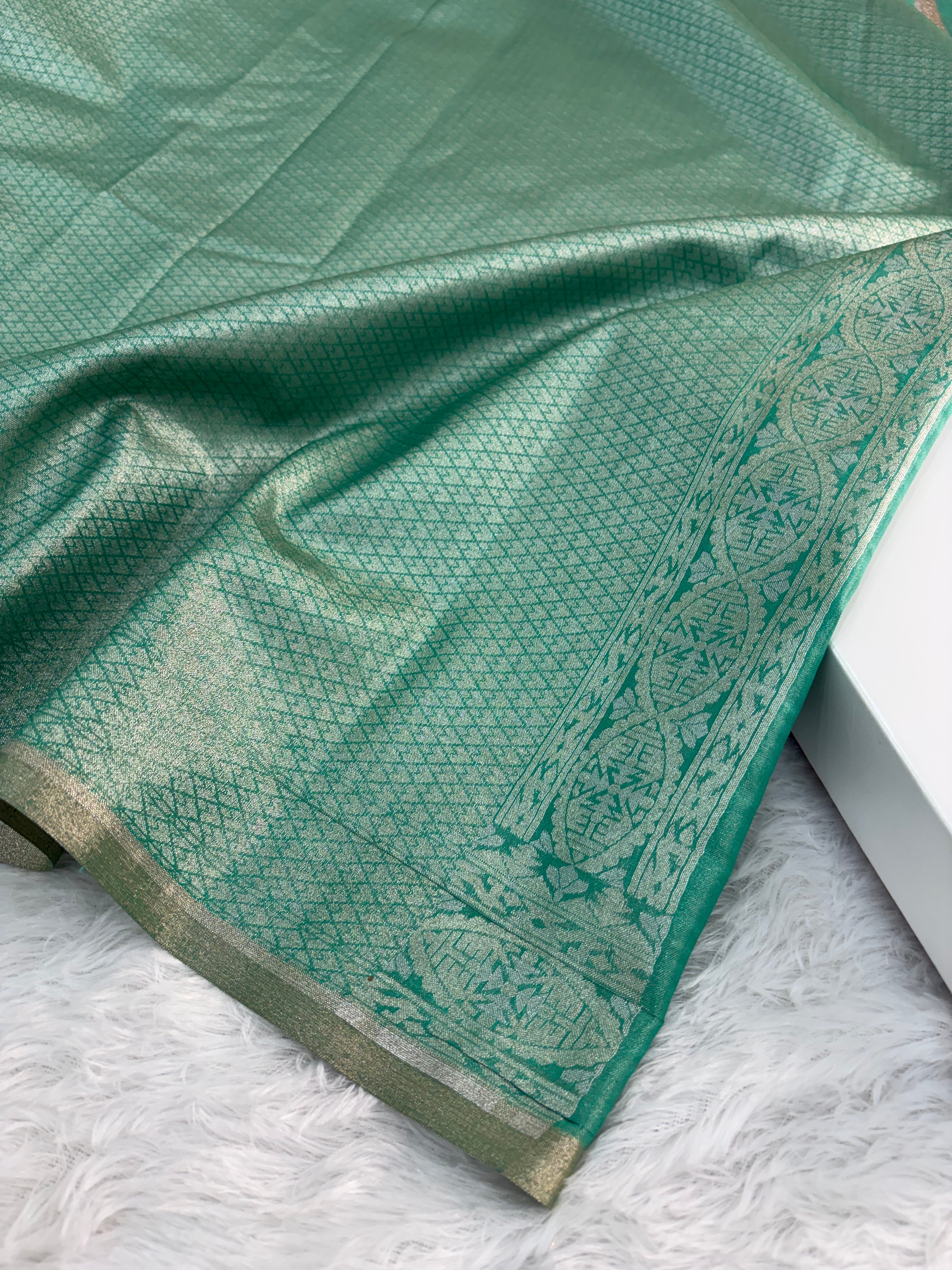 Banarasi tissue silk saree in bottle green color