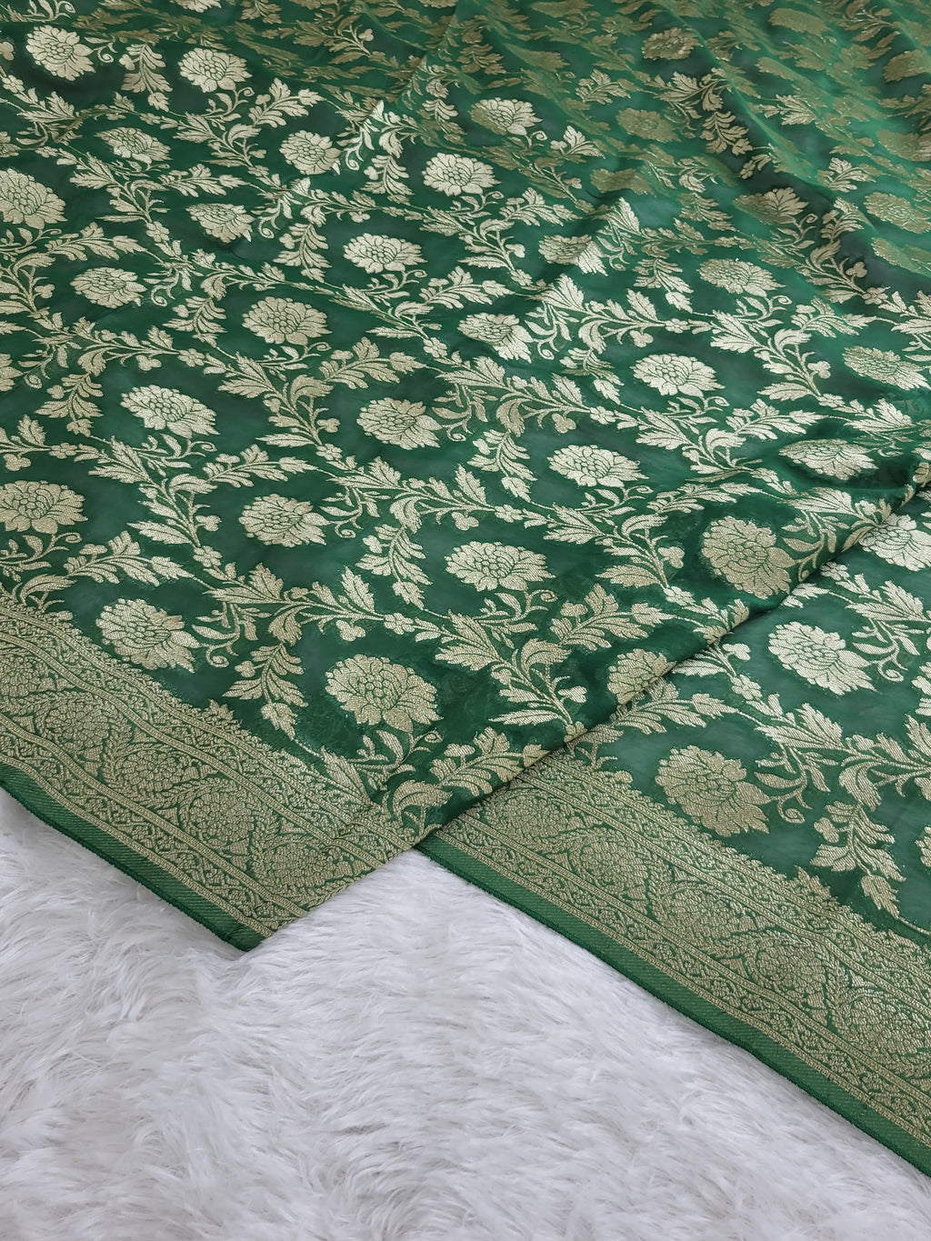 Georgette saree in floral jaal design in Bottle Green color