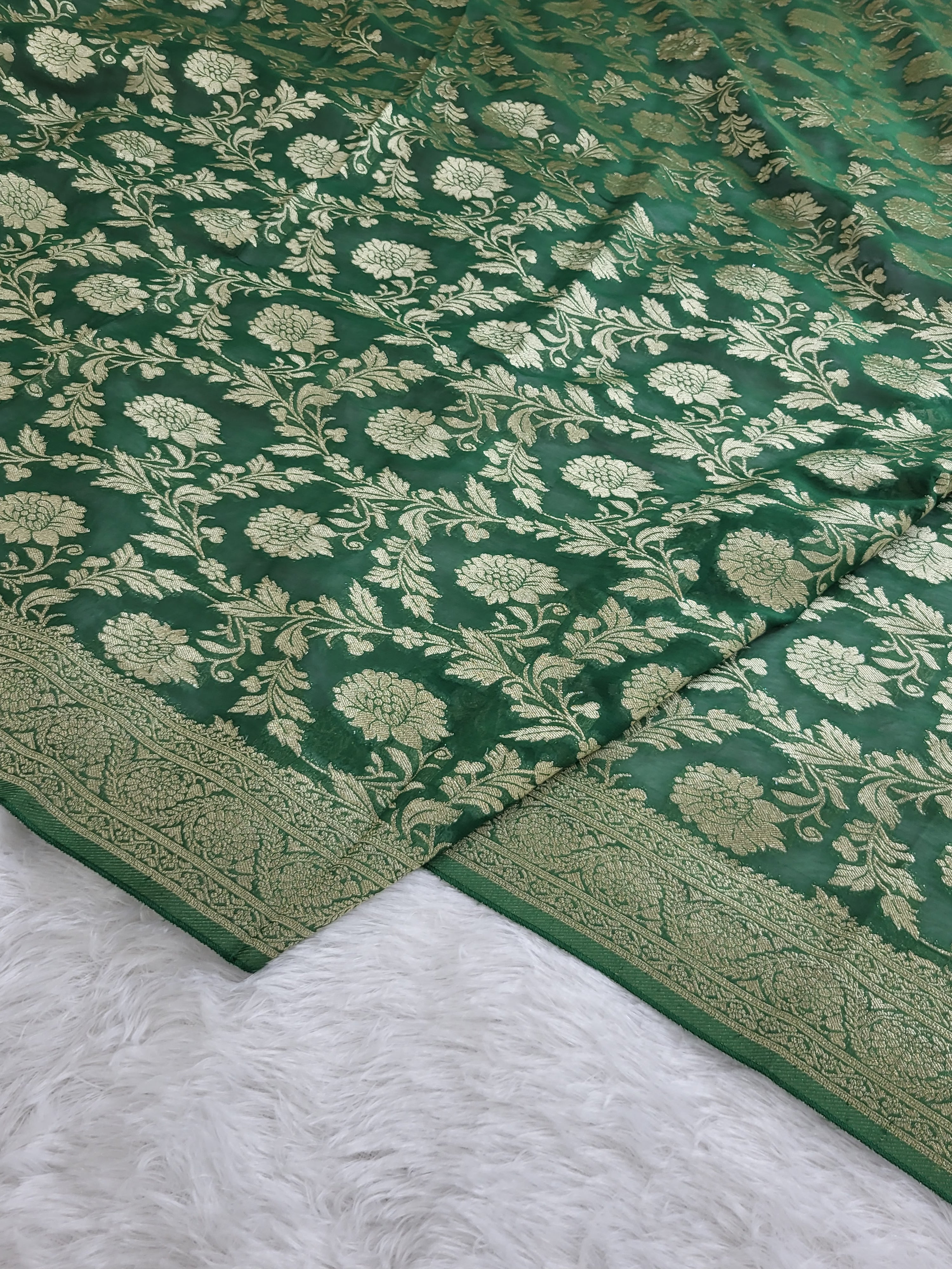 Georgette saree in floral jaal design in Bottle Green color