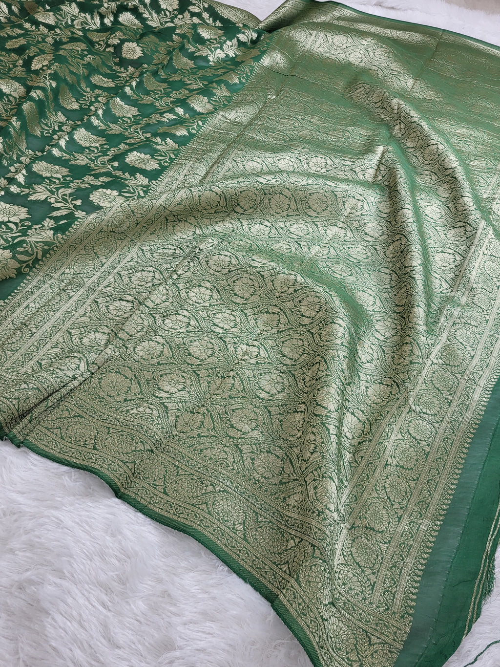Georgette saree in floral jaal design in Bottle Green color