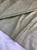 Banarasi tissue silk saree with floral buta design in Light Rusty Green color
