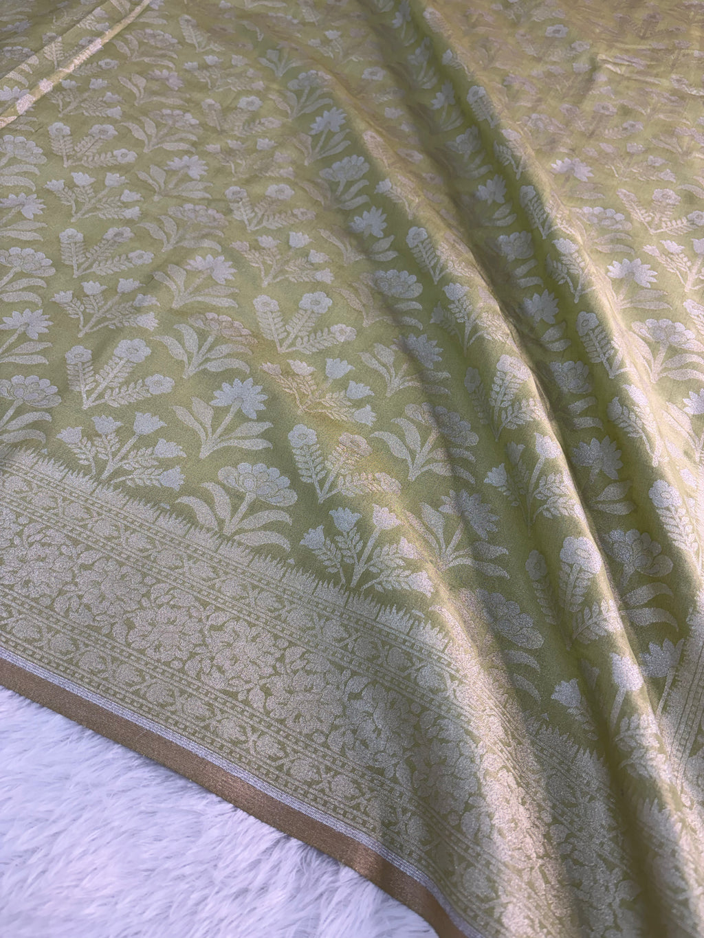 Banarasi tissue silk saree with floral buta design in Light Rusty Green color