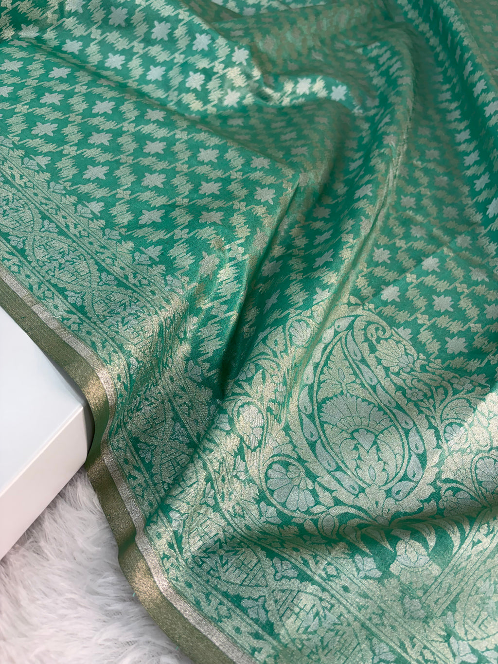 Banarasi tissue silk saree in bottle green color
