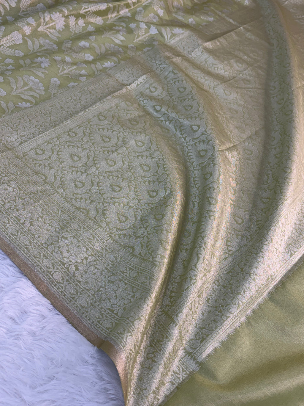 Banarasi tissue silk saree with floral buta design in Light Rusty Green color