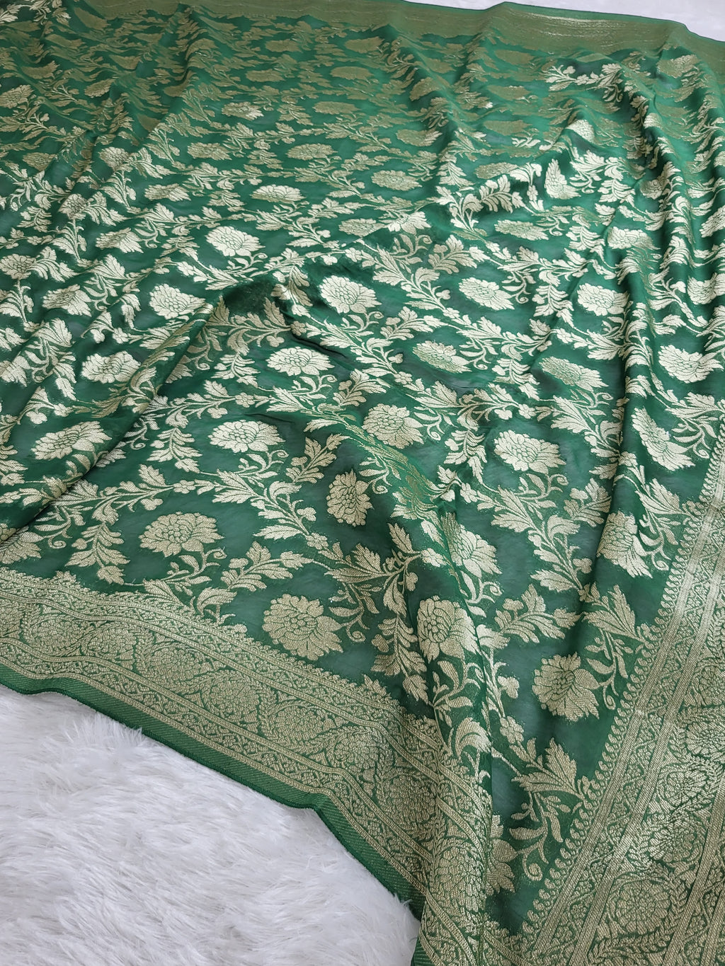 Georgette saree in floral jaal design in Bottle Green color
