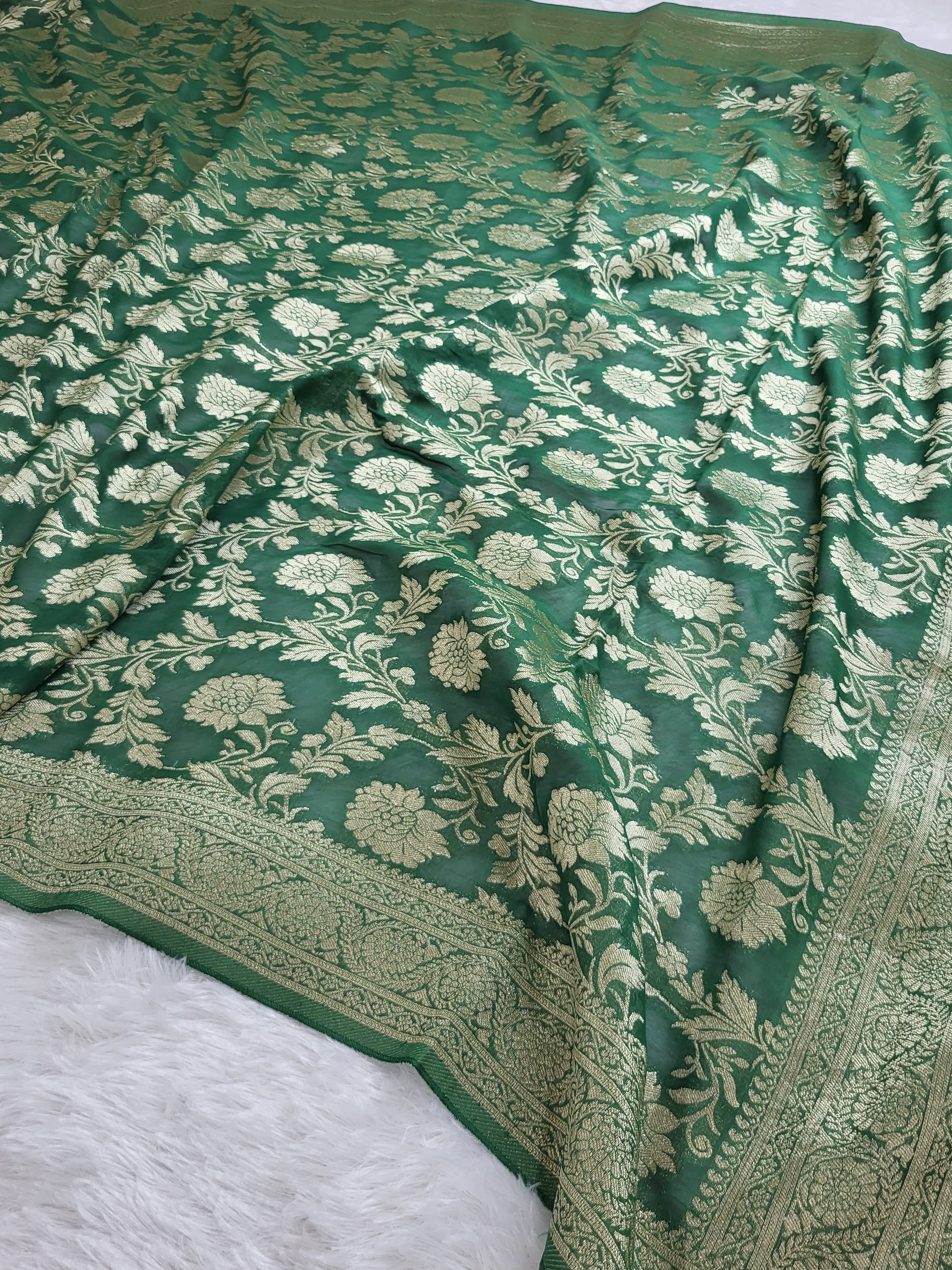 Georgette saree in floral jaal design in Bottle Green color