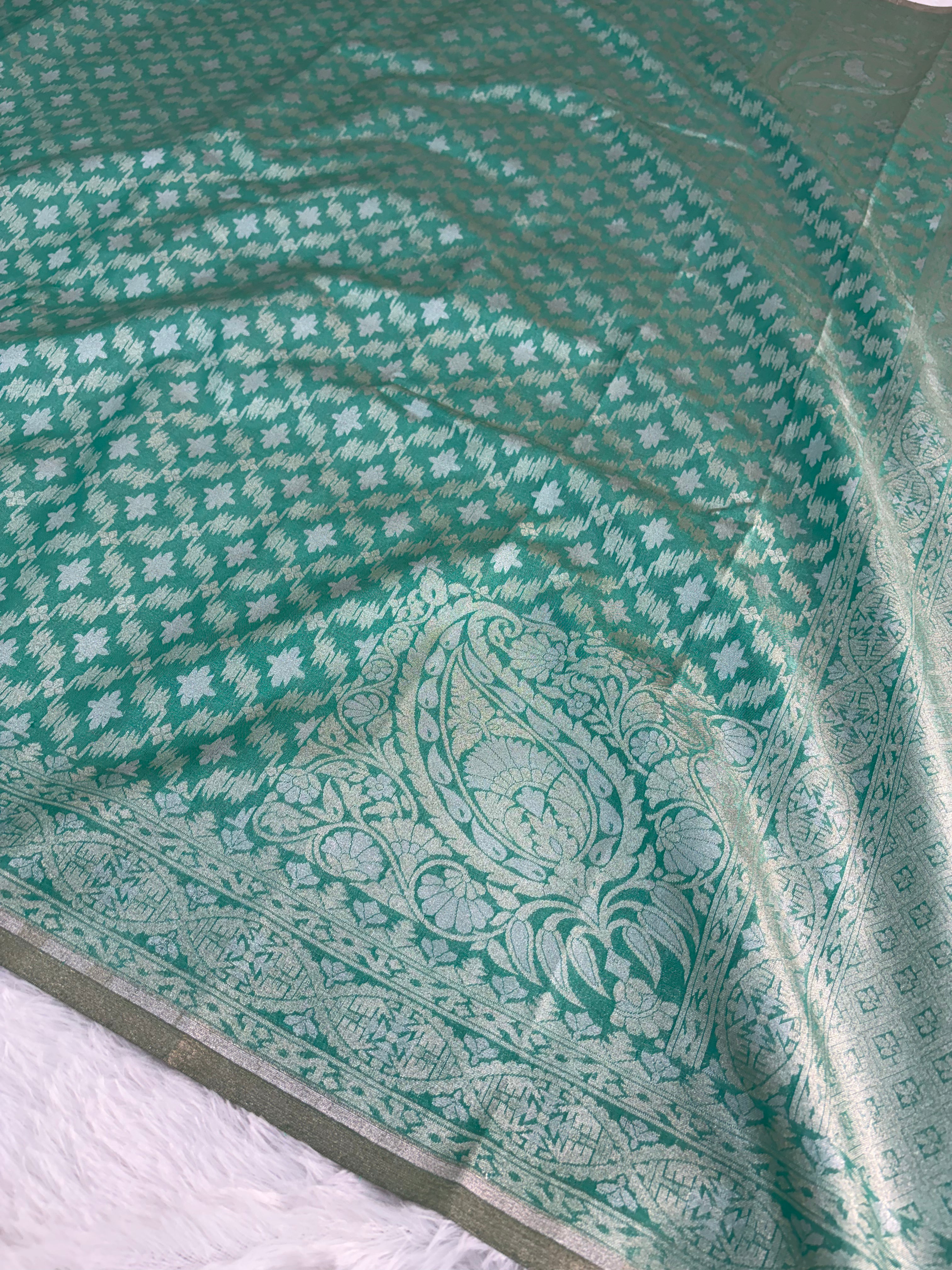 Banarasi tissue silk saree in bottle green color