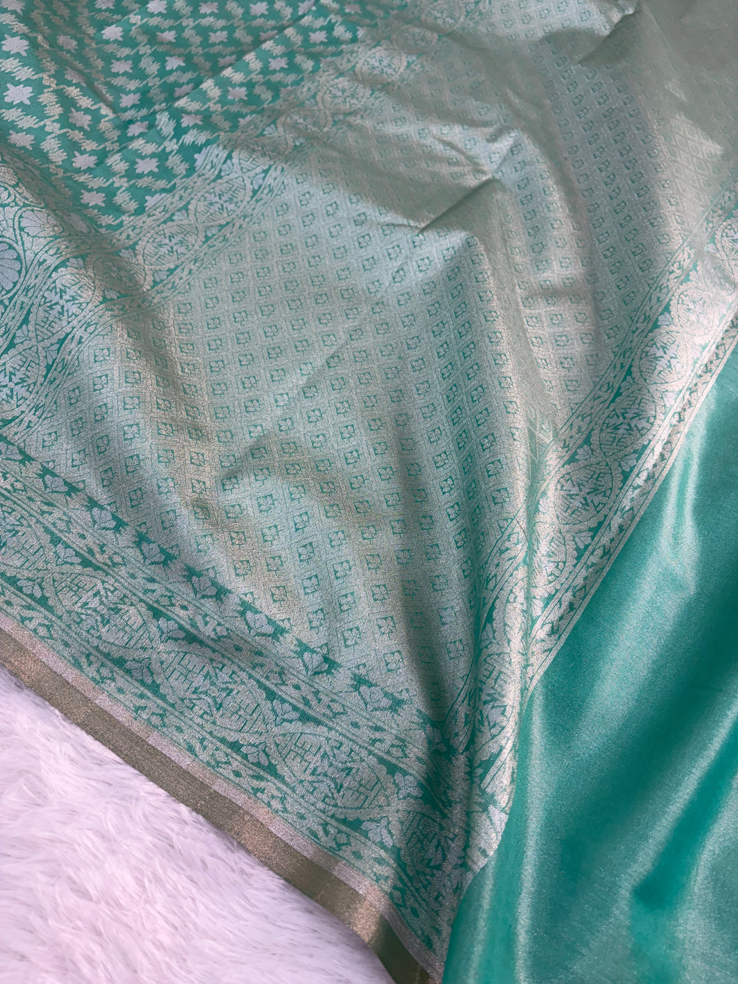 Banarasi tissue silk saree in bottle green color