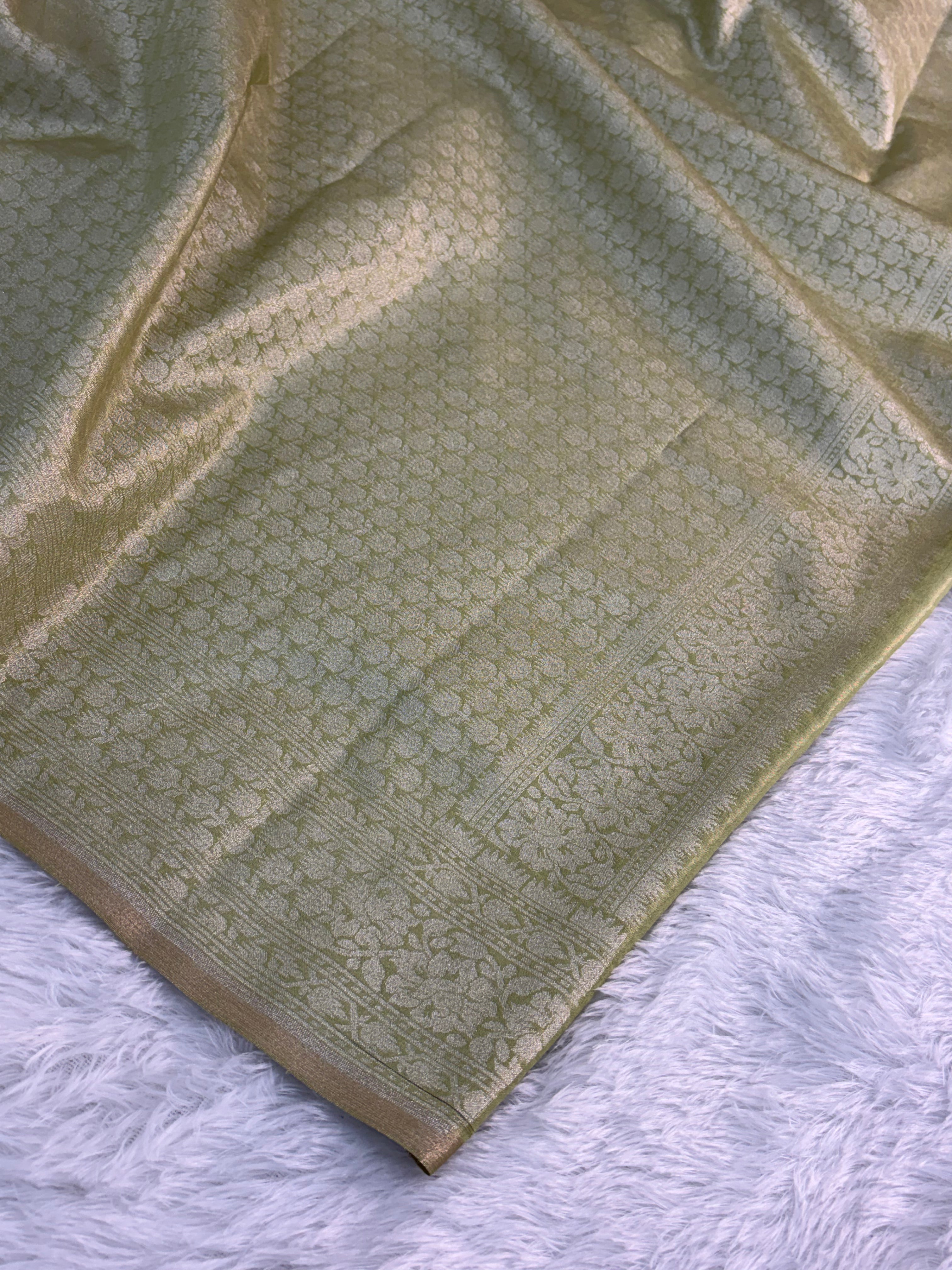 Banarasi tissue silk saree with floral buta design in Light Rusty Green color