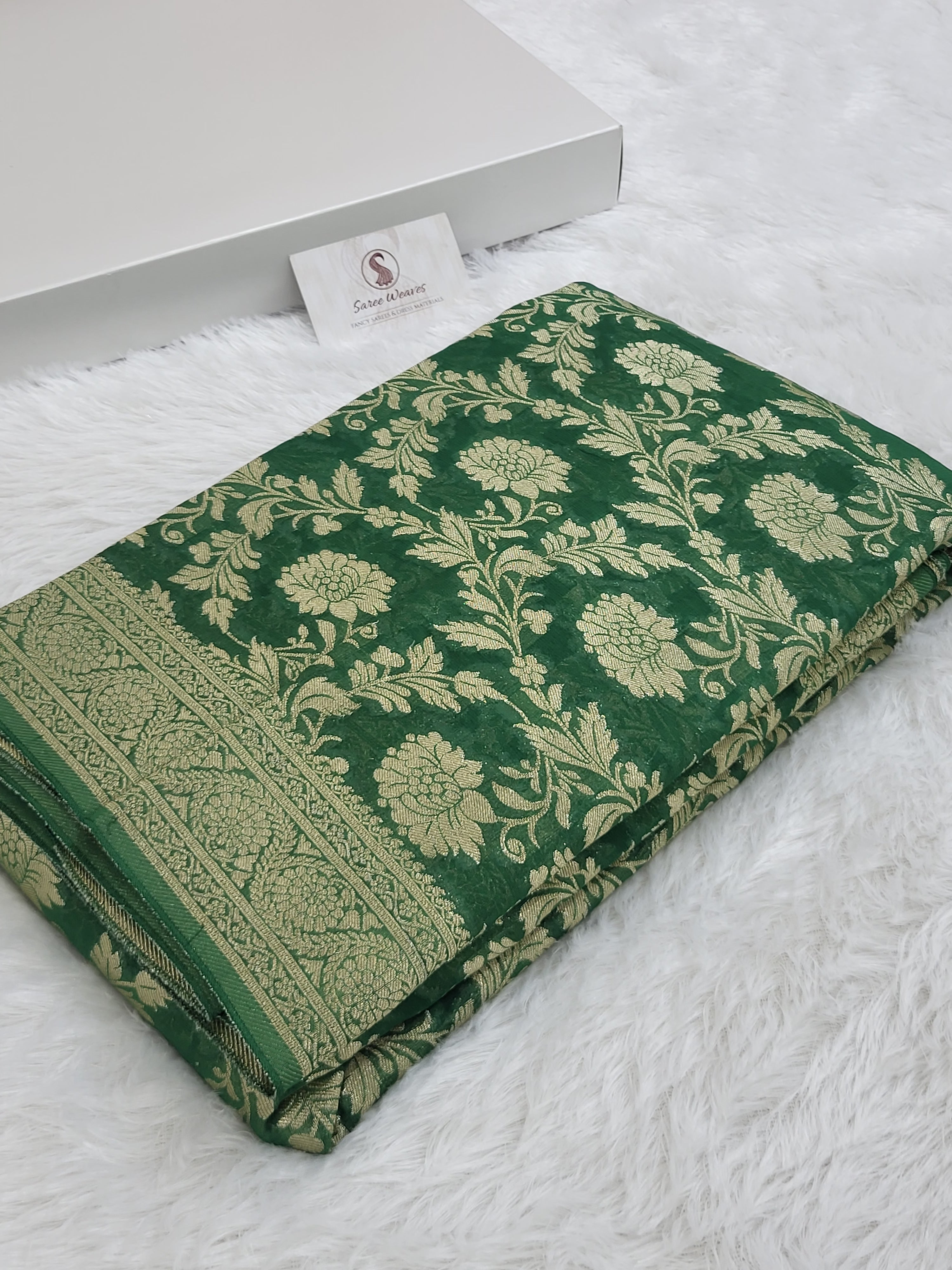 Georgette saree in floral jaal design in Bottle Green color
